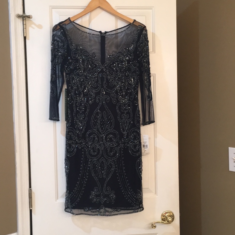 Beautiful 3/4 sleeve sheath dress.